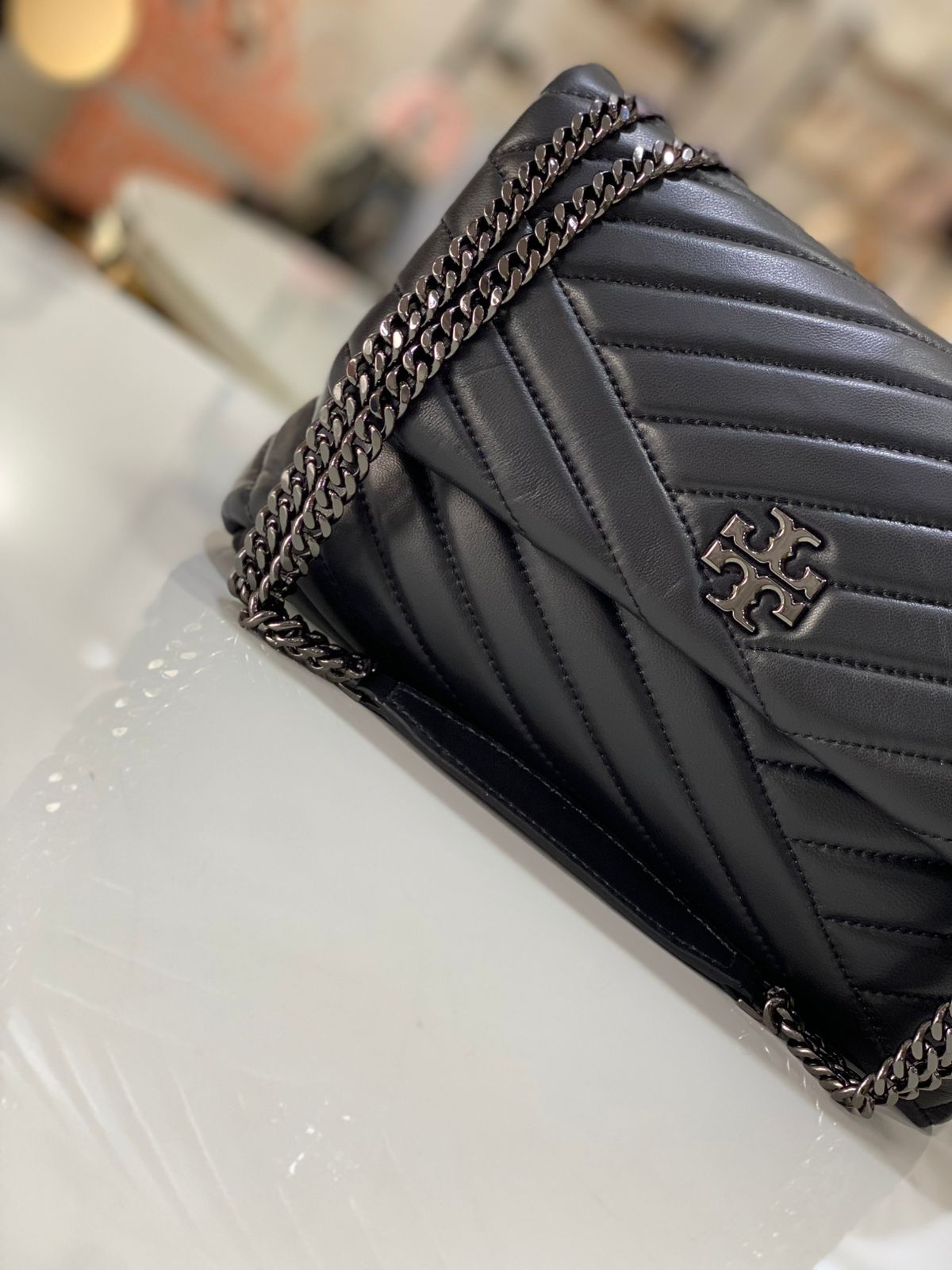 Tory Burch Kira Chevron Convertible Shoulder Bag in black with gunmetal-toned hardware