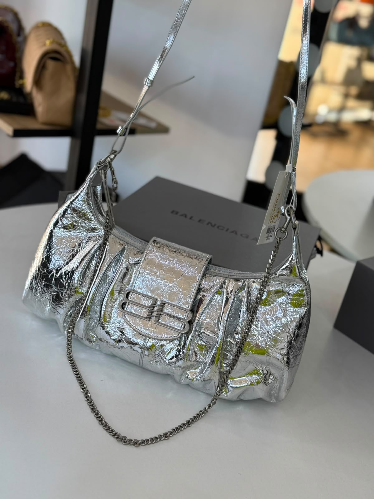Large Balenciaga Pamela shoulder bag features a crinkled leather finish and distinctive silver-tone hardware