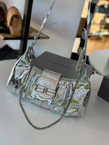 Large Balenciaga Pamela shoulder bag features a crinkled leather finish and distinctive silver-tone hardware
