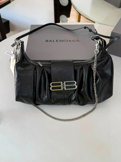 Large Balenciaga Pamela shoulder bag features a crinkled leather finish and distinctive silver-tone hardware