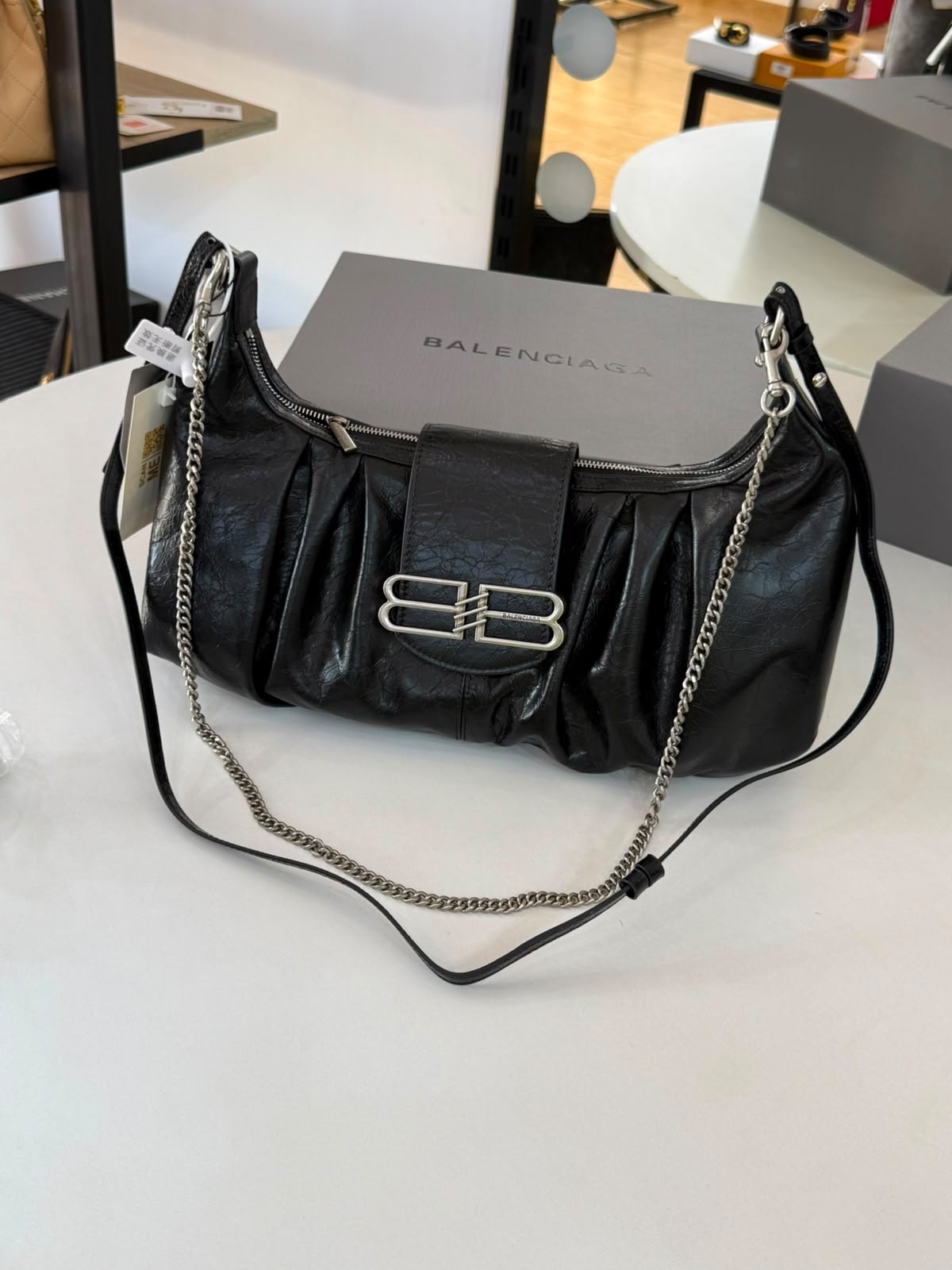 Large Balenciaga Pamela shoulder bag features a crinkled leather finish and distinctive silver-tone hardware