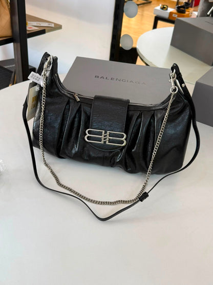 Large Balenciaga Pamela shoulder bag features a crinkled leather finish and distinctive silver-tone hardware