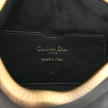 Christian Dior Vibe bag features black cannage quilted lambskin leather with a distinct half-moon shape