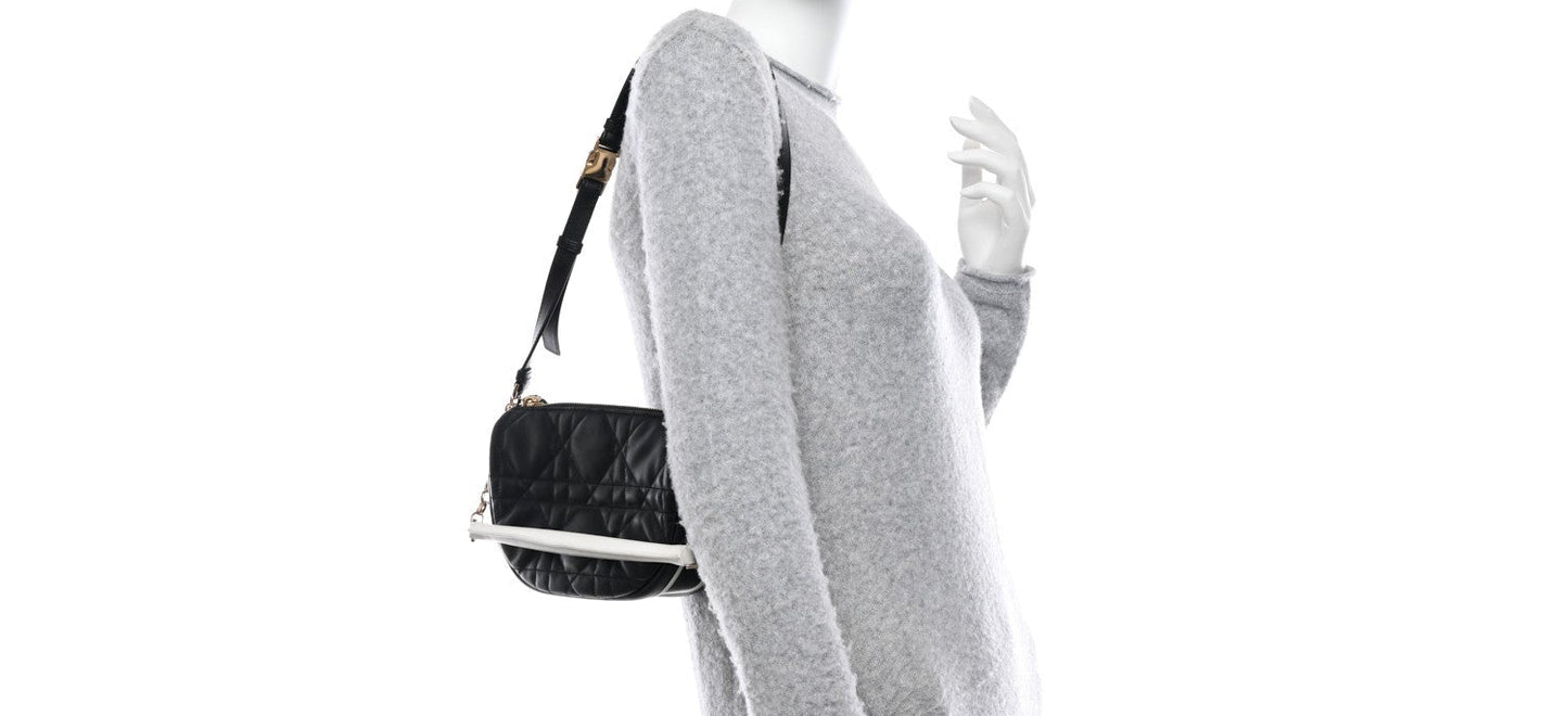 Christian Dior Vibe bag features black cannage quilted lambskin leather with a distinct half-moon shape