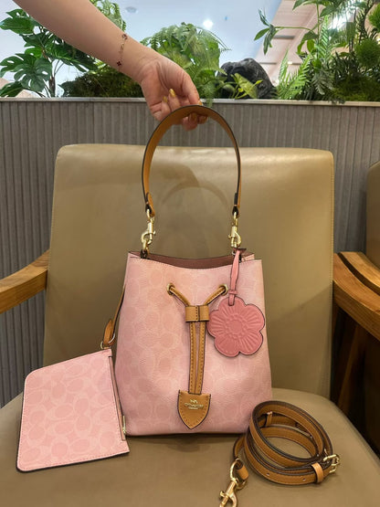 COACH Signature Canvas Blush Pink Drawstring Bucket Bag