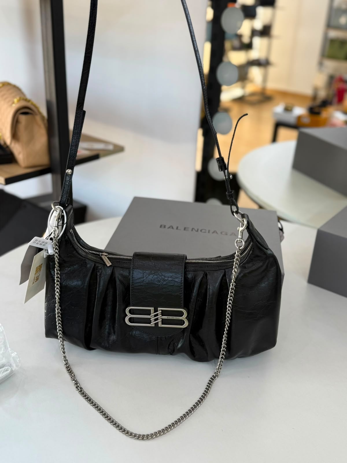 Large Balenciaga Pamela shoulder bag features a crinkled leather finish and distinctive silver-tone hardware