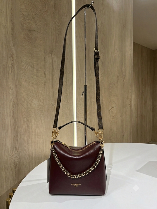 Burgundy Louis Vuitton Multipass handbag is crafted from smooth calfskin leather and adorned with a removable gold-toned braided chain