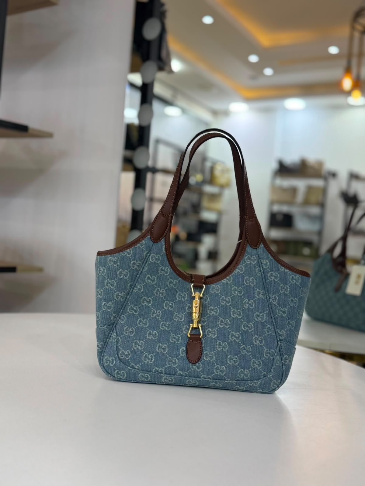 Gucci Jackie 1961 handbag in denim monogram canvas with brown leather trim