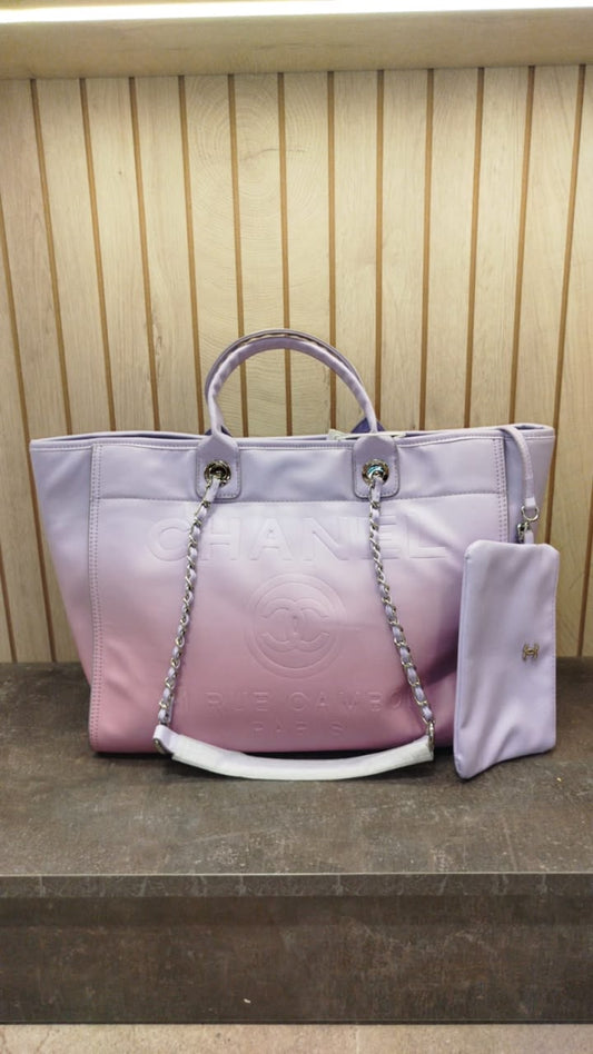 Chanel Deauville tote bag made of shaded calfskin in a light purple and pink color
