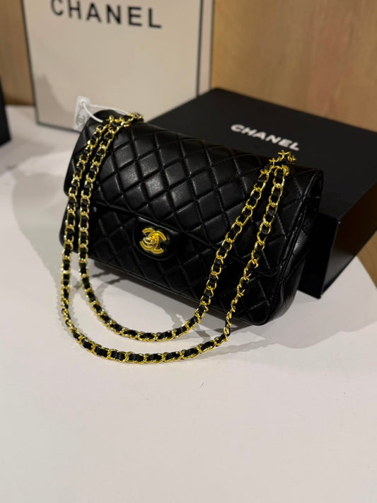 Chanel Classic Flap Bag (Black Quilted Lambskin with Gold-Tone Hardware)