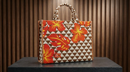 Prada Symbole Jacquard fabric handbag features a black and beige geometric pattern adorned with yellow and green embroidered floral motifs
