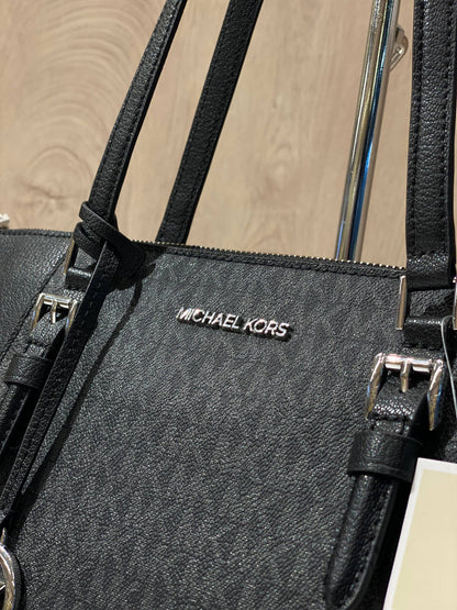 Michael Kors Charlotte Large Top Zip Tote in black logo print and leather.
