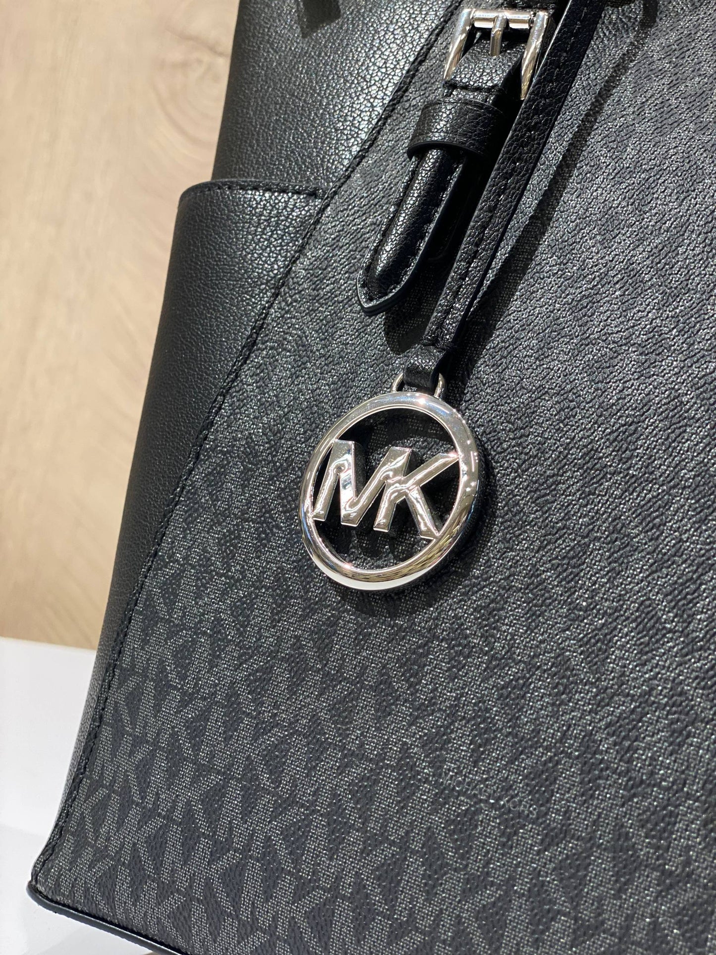 Michael Kors Charlotte Large Top Zip Tote in black logo print and leather.