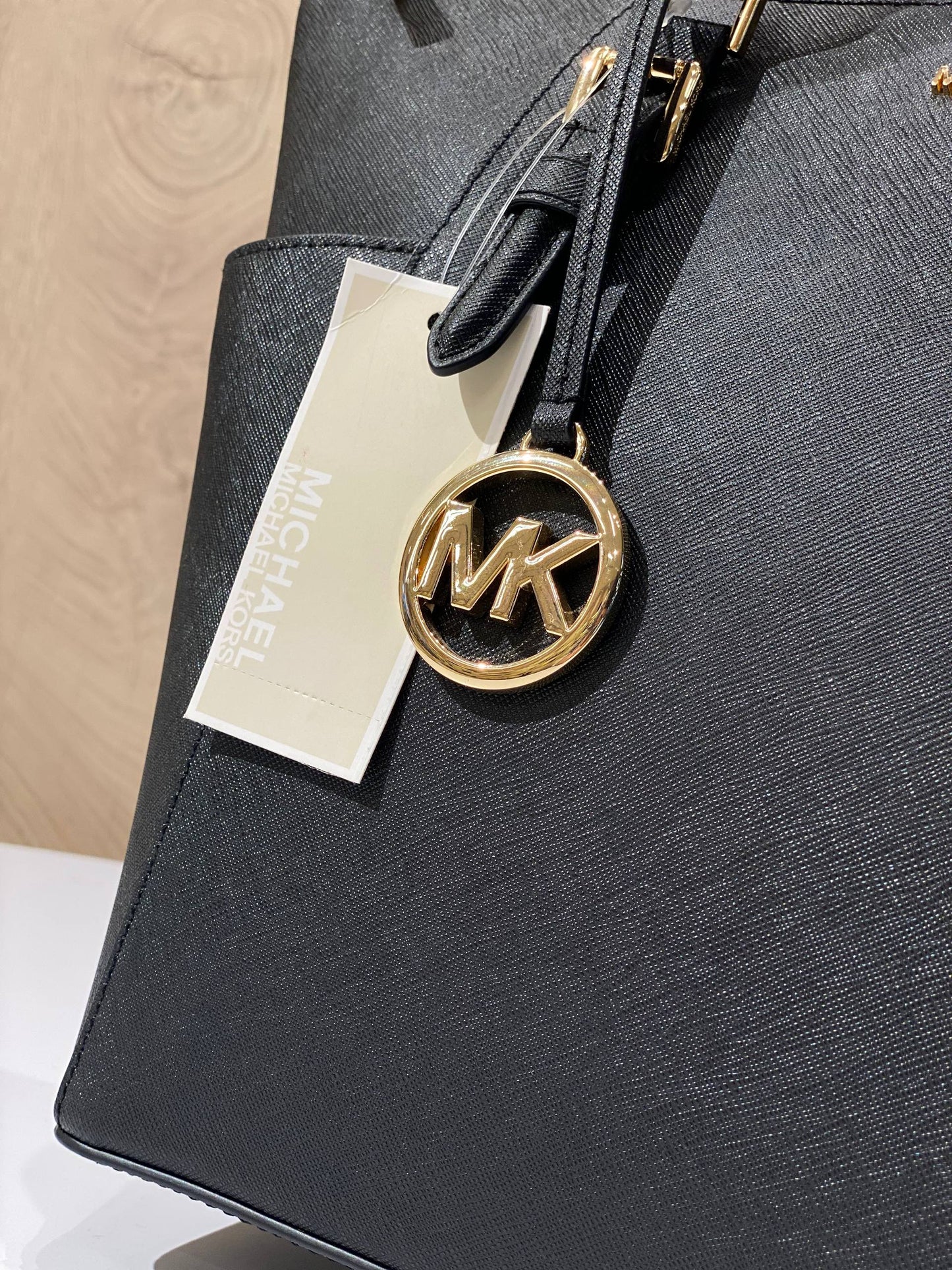 Michael Kors Charlotte Large Top Zip Tote in black Saffiano leather with gold-tone hardware