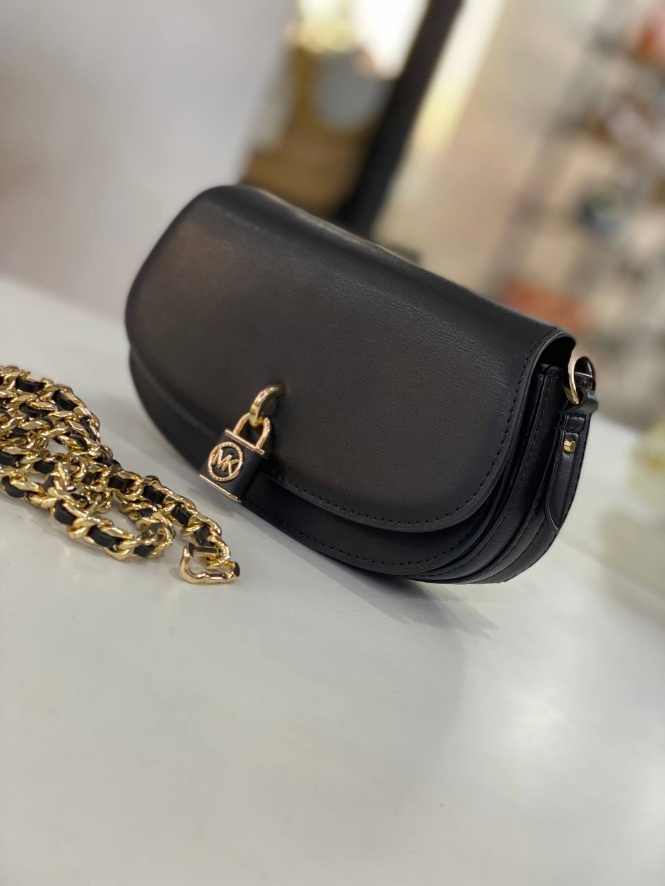 Michael Kors Mila Small Leather Shoulder Bag in black with gold-tone hardware