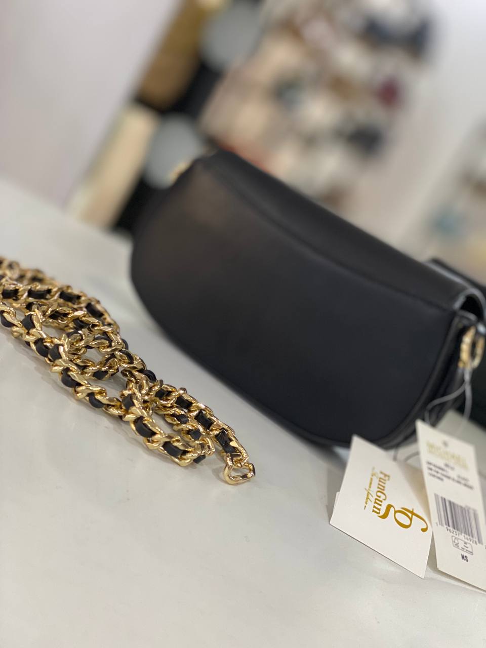 Michael Kors Mila Small Leather Shoulder Bag in black with gold-tone hardware